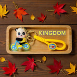 The Keychain Kingdom Panda On Bicycle Keychain, Cute Animal Charm With Coiled Strap Gold Ring Attachment Pack Of 1 Piece Only An