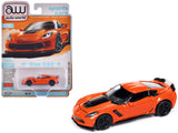 2019 Chevrolet Corvette Z06 Sebring Orange with Black Hood Sports Cars Series 1/64 Diecast Model Car by Auto World