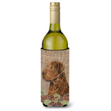 Curly Coated Retriever On Faux Burlap With Pine Cones Wine Bottle Beverage Insulator Beverage Insulator Hugger