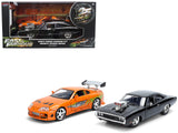 Doms 1970 Dodge Charger R/T Black and Brians Toyota Supra Orange with Graphics Set of 2 Cars Fast & Furious 25th Anniversary