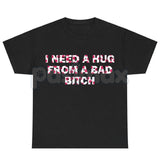 "I Need A Hug From A Bad Bitch" Funny Meme T-Shirt – Viral Sarcastic Graphic Tee, Premium 100% Cotton Humor Gift, Aesthetic Baddie Streetwear Top, Soft Lived-In Heavyweight Unisex Shirt, Made in USA