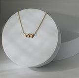 Holy Family Hearts® in 14K Gold Tiny Version