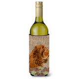 Sussex Spaniel On Faux Burlap With Pine Cones Wine Bottle Beverage Insulator Beverage Insulator Hugger